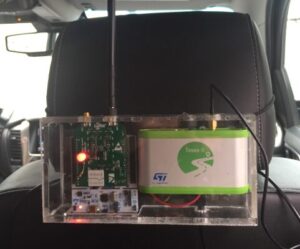 The low-power limo-tracker hardware demo fits on the back of the headrest.