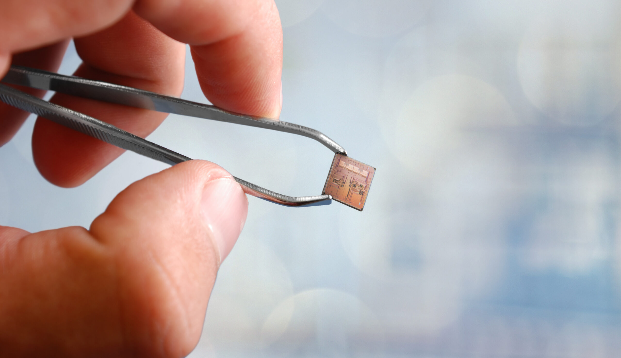 Tiny chip includes multiple radios and sensor interfaces, an application processor and ultra-low-power management circuits