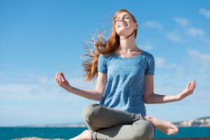 A woman performing a meditative pose