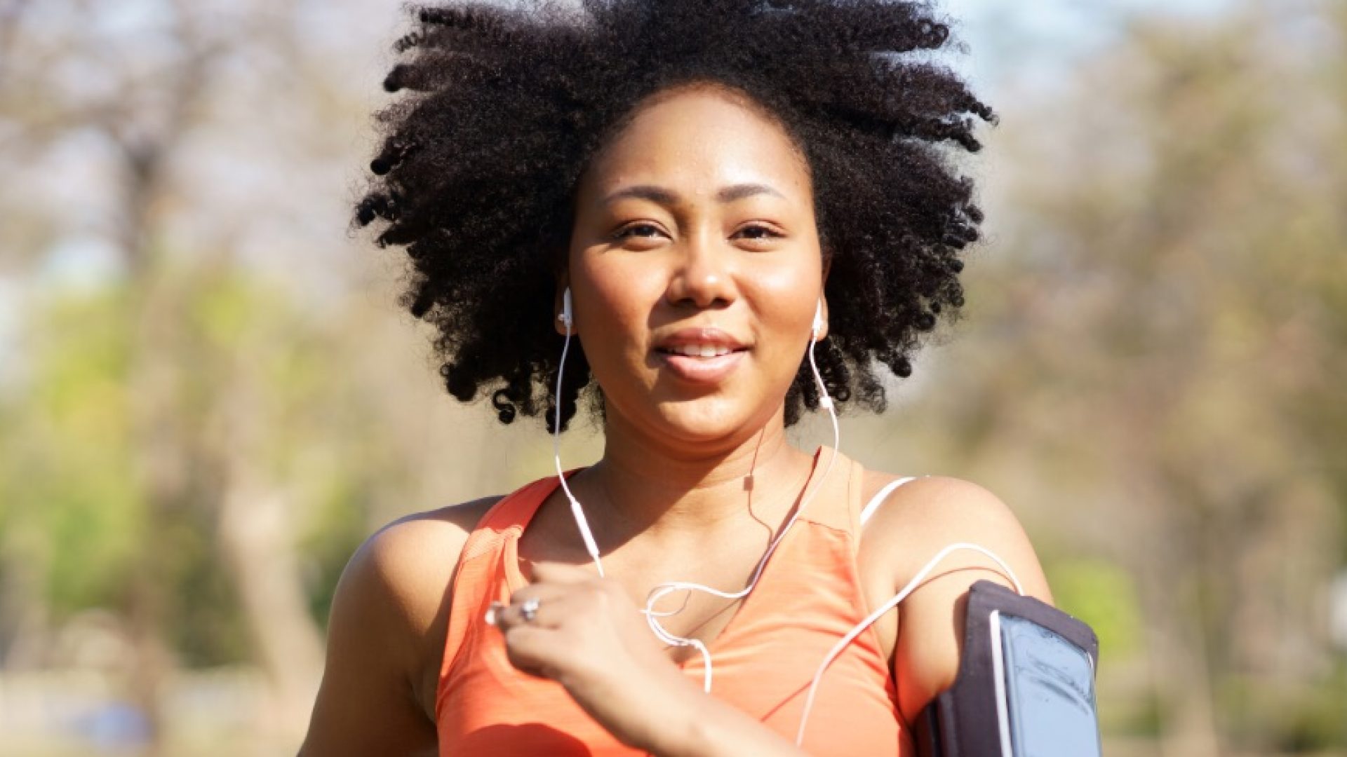 Young woman running exercise wearing heartbeat monitoring and smart watch