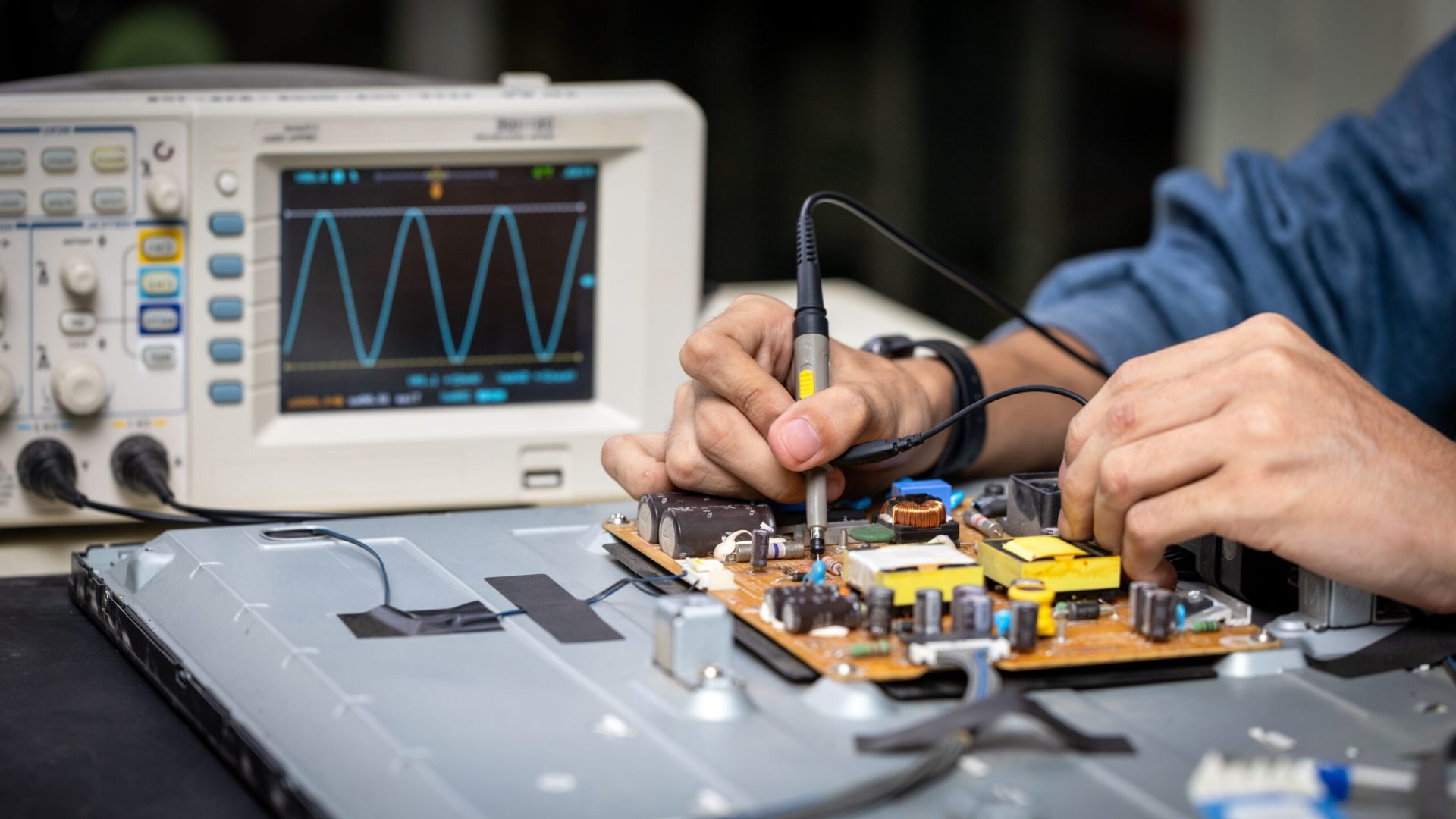 Electronic technician,banner, hands repairing electronic devices The use of modern one-stop service center concepts