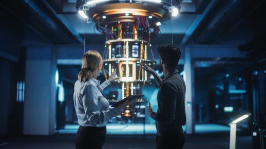 Middle Aged Caucasian Female Team Leader and Young Indian Scientist Talking in a Research Center with a Futuristic Quantum Computer Device. Specialists Discussing Machine Learning Development; Shutterstock ID 2615909665; purchase_order: 1106262587; job: ; client: 4000557855; other: