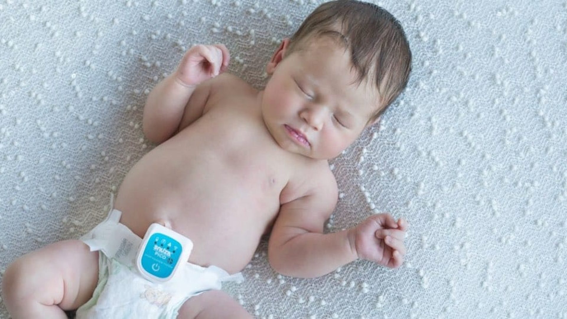 The Pico from Snuza on a baby