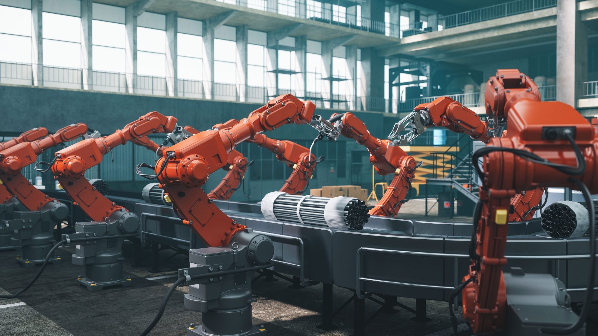 Industrial robots at the automated manufacturing factory assembly line.