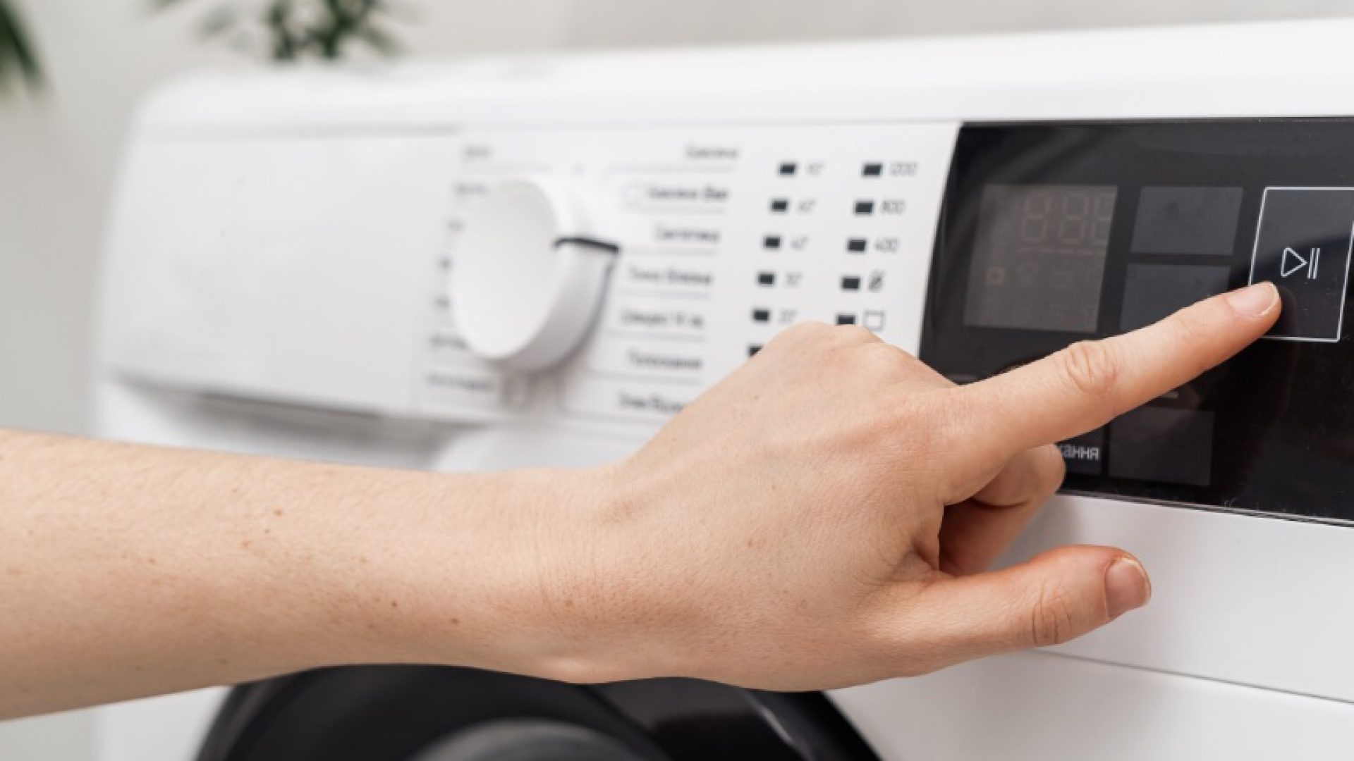 Selective focus on cropped woman hand select settings for laundry on modern digital display. Close up view of automatic washing machine with touch screen on control panel. Female press start or pause; Shutterstock ID 1912367236; purchase_order: 1106262587; job: ; client: ; other: