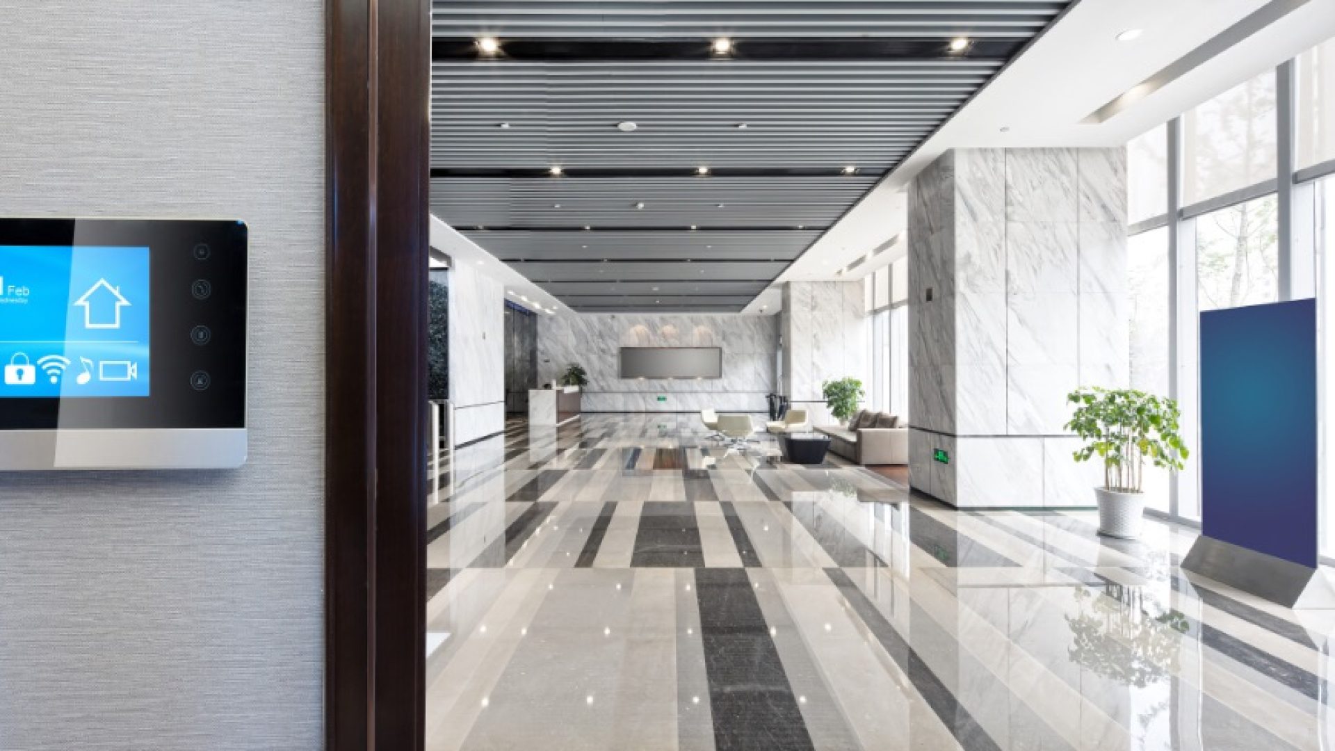 smart screen on wall with spacious hall in modern office building; Shutterstock ID 675097483; purchase_order: 1106262587; job: ; client: ; other: